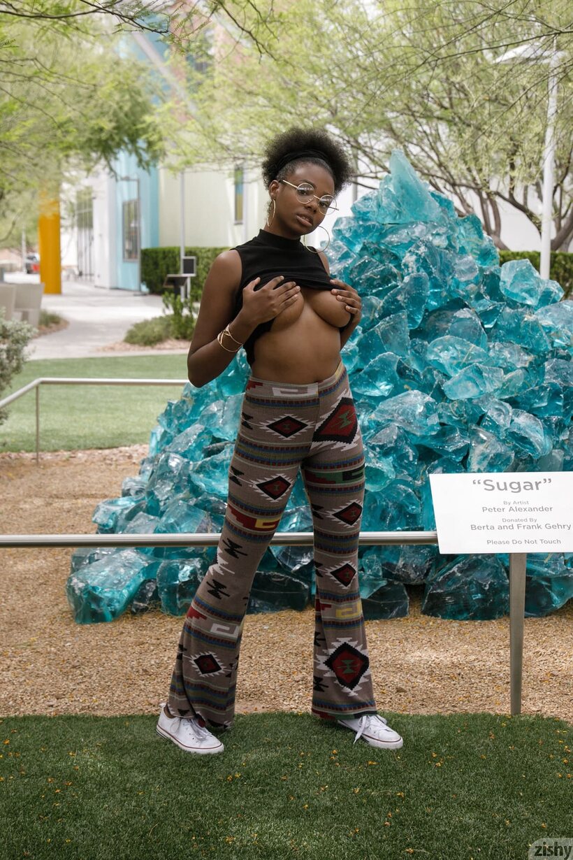 Clothed Neda Marie in glasses shows her ass outdoors (shot 4)