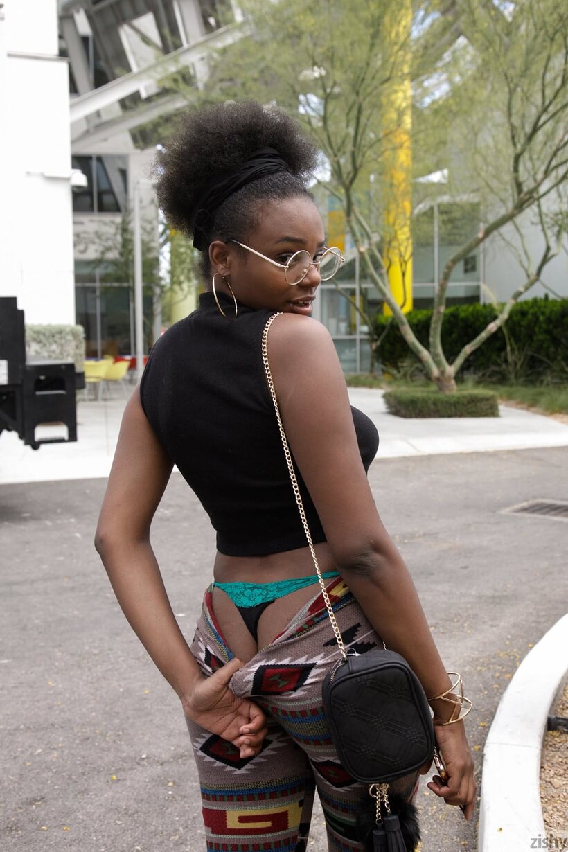 Photo 5 — Clothed Neda Marie in glasses shows her ass outdoors